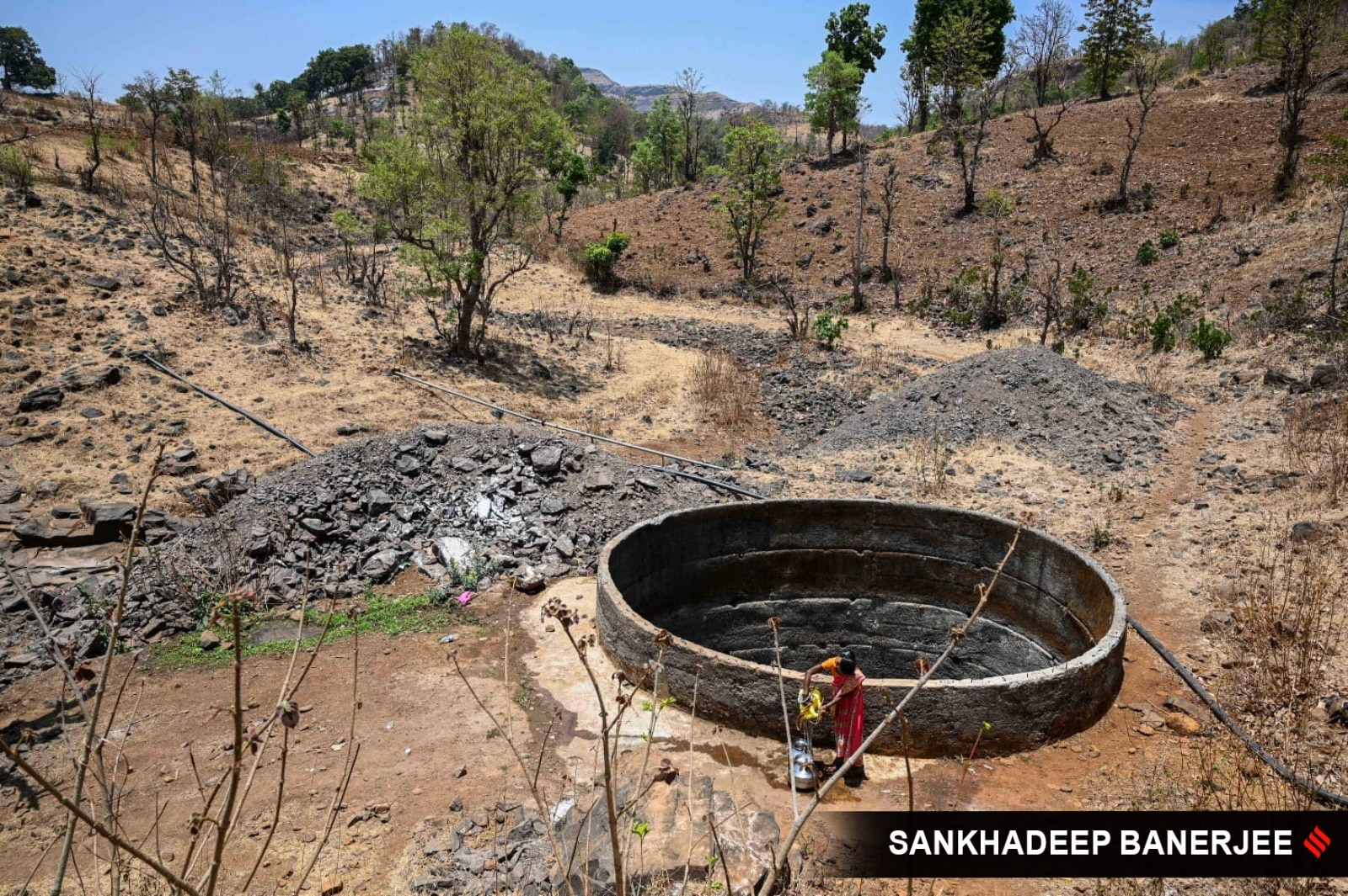 In order to get to the nearest “baudi”, villagers walk 2-3 km up and down daily, trekking through the uneven terrain of the plateau. (Express Photo)