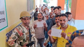 Rajouri: People wait to cast votes at a polling station during sixth phase of Lok Sabha polls, at Dhangri village in Rajouri district, Saturday, May 25, 2024. (PTI Photo)