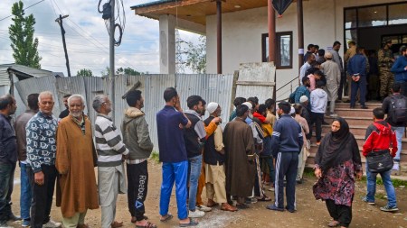Voters wait in a queue at a polling station to cast their votes for the fourth phase of Lok Sabha elections, in Downtown, Srinagar, Monday, May 13, 2024. (PTI Photo)