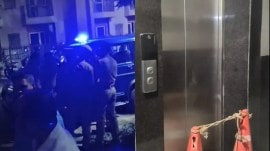 After the incident, the residents gathered on the premises after coming down using the stairs as both lifts of the tower were closed. (Express Photo)