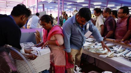 Election officials inspect polling materials at a distribution centre, ahead of the fifth phase of India's general election, in Howrah district in the eastern state of West Bengal