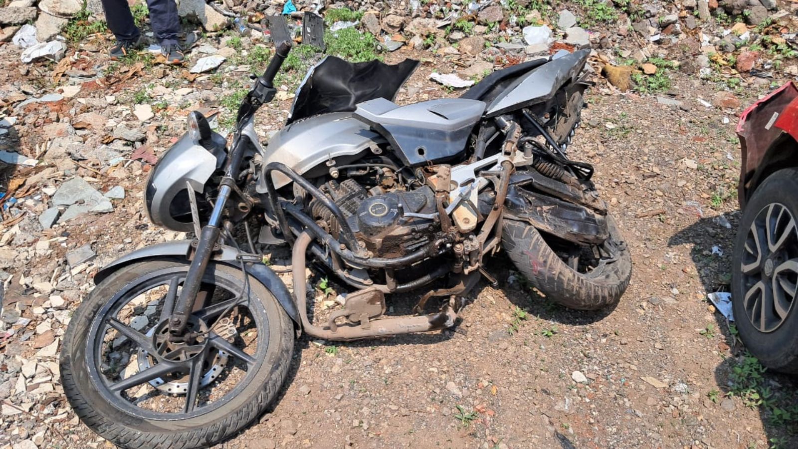 The speeding luxury car knocked down the motorcycle. (Express photo)