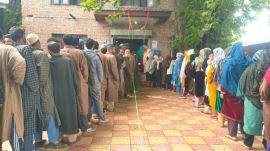 Voters queue at Lassipora in Pulwama district during phase 4 of Lok Sabha elections. (Express photo by Shuaib Masoodi)