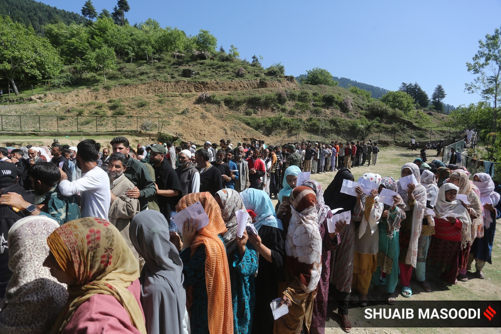 Voters queuing outside a polling station in Kupwara.  (Express photo by Shuaib Masoodi)