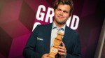 Magnus Carlsen with the trophy after winning the 2024 Superbet Rapid & Blitz Poland on Sunday. (Photo courtesy of Grand Chess Tour/Lennart Ootes)