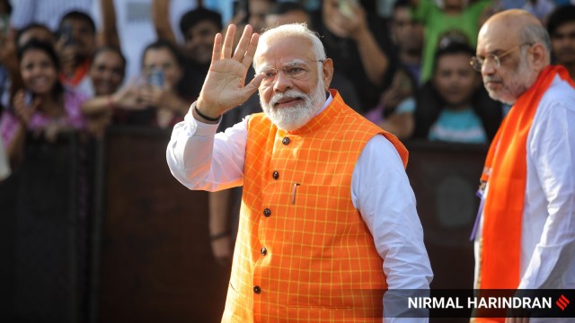 PM Narendra Modi casting his vote in Ahmedabad, during the Lok Sabha elections. (Express photo by Nirmal Harindran)