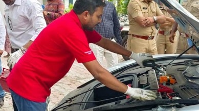 Technical team from Porsche company checking the car at Yerwada police station on Monday. (Express photo)