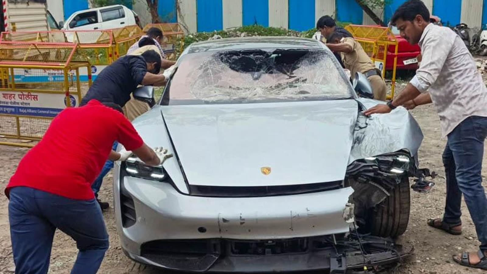 Technical team from Porsche company checking the car at Yerwada police station on Monday. (Express photo)
