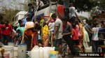 Delhi News Live Updates: Residents of the Vivekananda camp fill water from a tanker