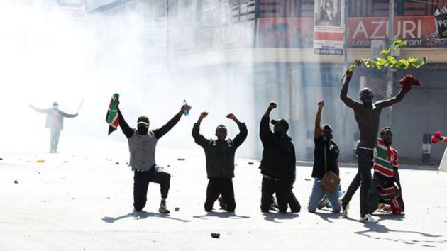 Protesters recoil from tear gas deployed by police during a demonstration against Kenya's proposed finance bill. Introduced in Parliament in May, the bill sparked intense debate last week, with opposition lawmakers supporting the impassioned demonstrators.
