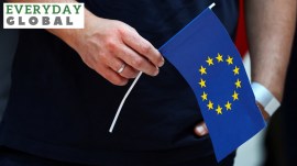 a pair of hands holding the EU flag