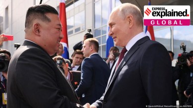 Kim Jong Un and Vladimir Putin shaking hands.