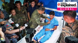 In this photo provided by Armed Forces of the Philippines, Philippine military chief General Romeo Brawner Jr. pins a medal on a Navy personnel.