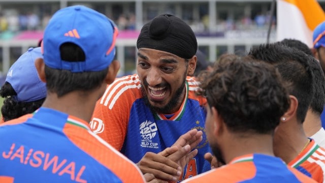 India's Arshdeep Singh, center, shares a light moment with teammates after defeating South Africa in the ICC Men's T20 World Cup final cricket match at Kensington Oval in Bridgetown, Barbados