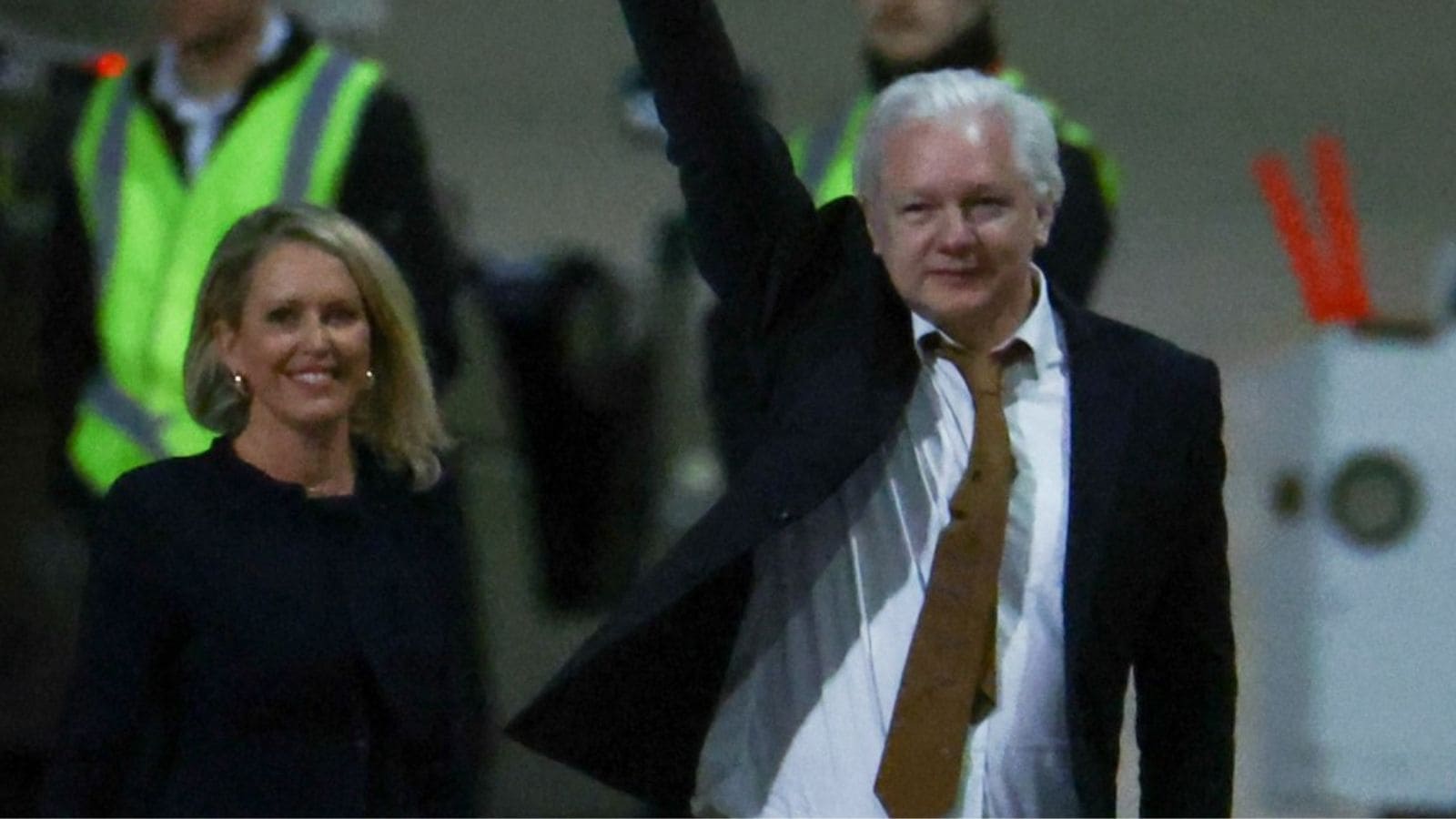 WikiLeaks founder Julian Assange waves as he arrives in Canberra, Australia, June 26, 2024. (Reuters)