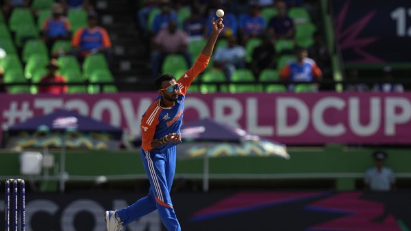 India's Axar Patel bowls a delivery during the ICC Men's T20 World Cup second semifinal cricket match between England and India at the Guyana National Stadium in Providence, Guyana