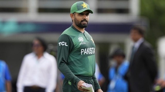 Pakistan's captain Babar Azam waits for the coin toss before the beginning of the ICC Men's T20 World Cup cricket match between Ireland and Pakistan at the Central Broward Regional Park Stadium, Lauderhill, Fla., Sunday, June 16, 2024. (AP Photo/Lynne Sladky)