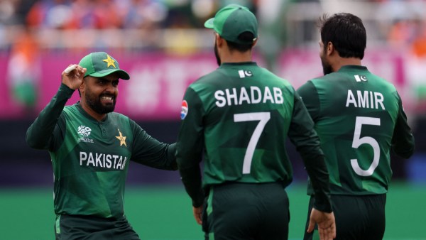 Pakistan's Babar Azam celebrates with Mohammad Amir and Shadab Khan after the wicket of India's Ravindra Jadeja