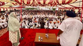 SAD president Sukhbir Singh Badal (right) looks on while Harsimrat Kaur Badal (left) addresses during the thanks giving function after winning from Bathinda