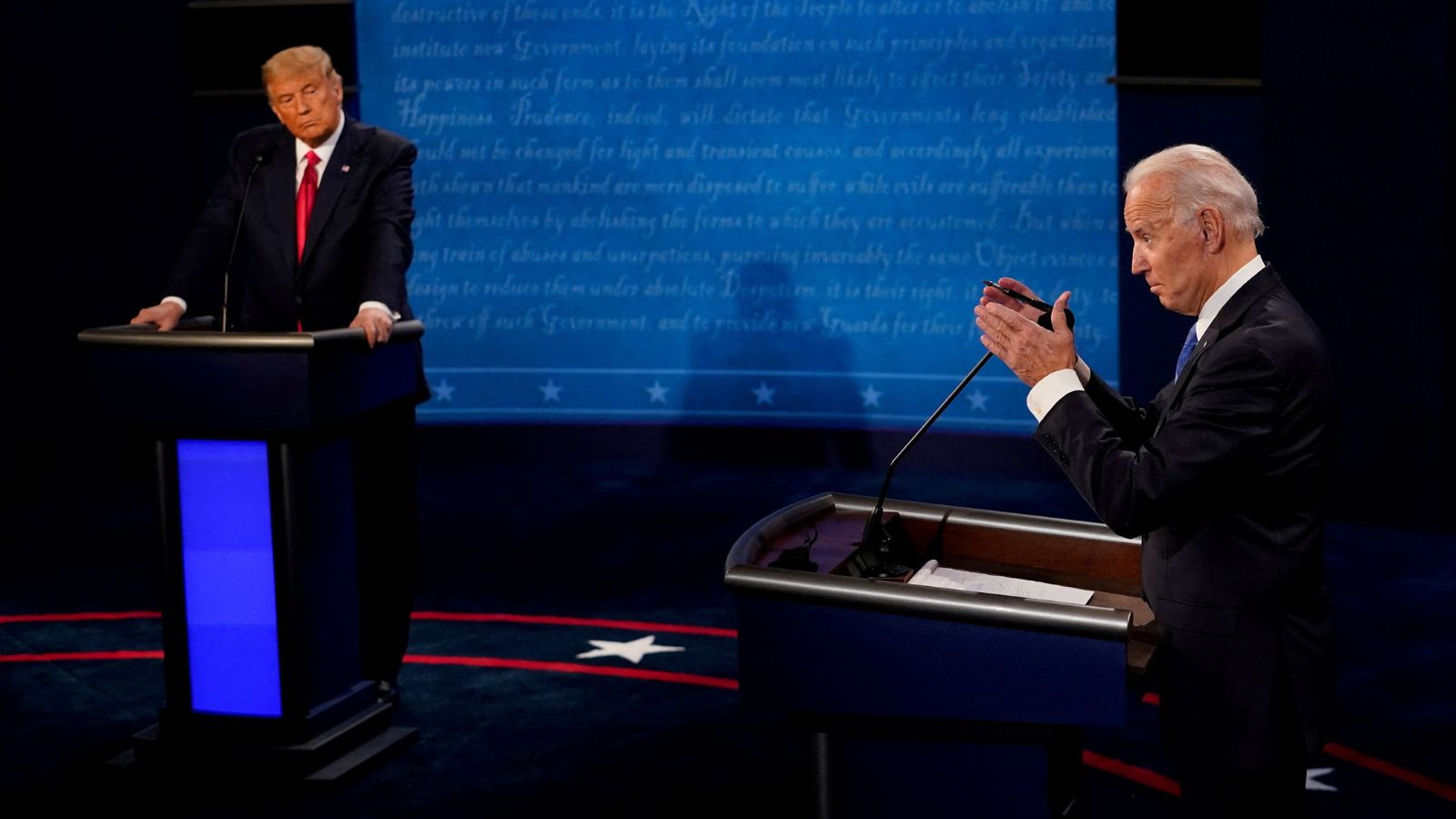 President Joe Biden answers a question as President Donald Trump listens during the second and final presidential debate at the Curb Event Center at Belmont University in Nashville, Tennessee, U.S., October 22, 2020. (Reuters)