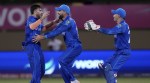 Afghanistan vs New Zealand Live: Afghanistan's Fazalhaq Farooqi, left, celebrates the dismissal of New Zealand's Daryl Mitchell during an ICC Men's T20 World Cup cricket match at Guyana National Stadium in Providence, Guyana