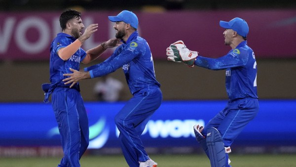 Afghanistan vs New Zealand Live: Afghanistan's Fazalhaq Farooqi, left, celebrates the dismissal of New Zealand's Daryl Mitchell during an ICC Men's T20 World Cup cricket match at Guyana National Stadium in Providence, Guyana