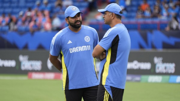 IND VS ENG: Indian team head coach Rahul Dravid, right, speaks to captain Rohit Sharma ahead of the ICC Men's T20 World Cup cricket match between Canada and India at the Central Broward Regional Park Stadium, Lauderhill, Fla., Saturday, June 15, 2024. (AP Photo)