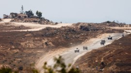 Israeli military vehicles maneuver inside the Gaza Strip