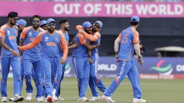 Indian players celebrate the dismissal of Pakistan's Iftikhar Ahmed during the ICC Men's T20 World Cup cricket match between India and Pakistan at the Nassau County International Cricket Stadium in Westbury, New York