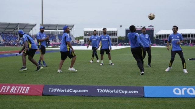 India vs Australia, Weather forecast: India's captain Rohit Sharma, second left, and teammates play with a soccer ball after wet outfield delayed the start of the ICC Men's T20 World Cup cricket match between Canada