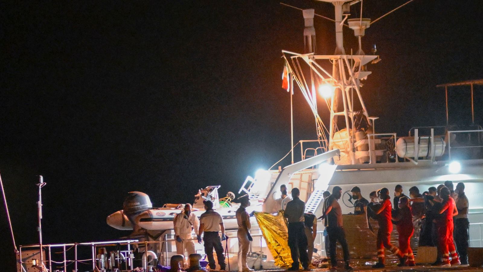 Italian coast guard searches for dozens of migrants missing after their ...