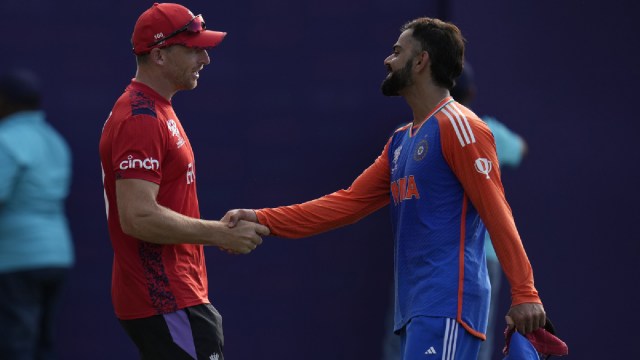 India's Virat Kohli, right, shake hands with England's captain Jos Buttler at the end of the ICC Men's T20 World Cup second semifinal cricket match between England and India at the Guyana National Stadium in Providence, Guyana