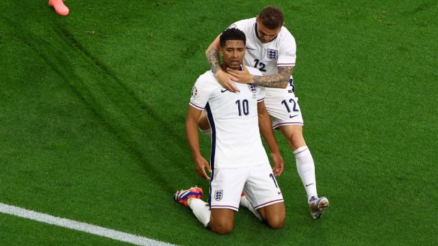 England's Jude Bellingham celebrates scoring their first goal with Kieran Trippier
