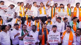 BJP leaders and workers during a protest against the Karnataka State government over price rise of essential commodities at Freedom Park, in Bengaluru, on June 17, 2024.