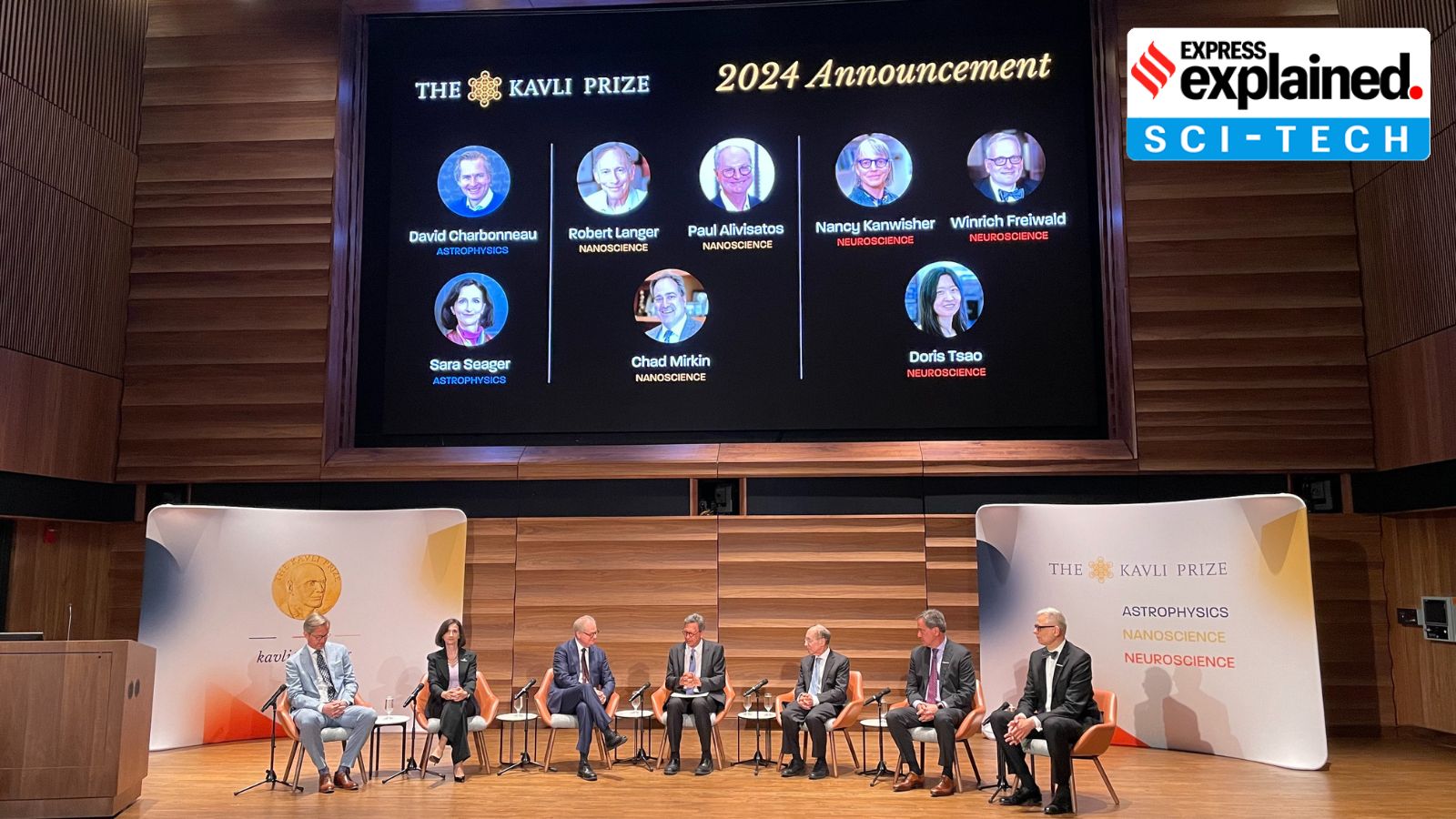 7 out of the 8 winners of the Kavli Prize seen sitting on a stage