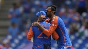 India's Axar Patel embraces Kuldeep Yadav during an ICC Men's T20 World Cup cricket match. (AP)