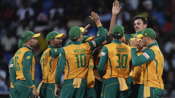 South African players celebrate the wicket of West Indies' Shai Hopeduring the ICC Men's T20 World Cup cricket match between the West Indies and South Africa at Sir Vivian Richards Stadium in North Sound, Antigua and Barbuda