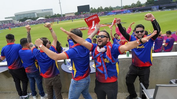 Nepal's fans cheer for their team during an ICC Men's T20 World Cup cricket match against the Netherlands at Grand Prairie Stadium in Grand Prairie, Texas