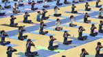 Youths perform yoga as they rehearse ahead of International Yoga Day Celebration at Kalinga Stadium in Bhubaneswar. (Reuters)