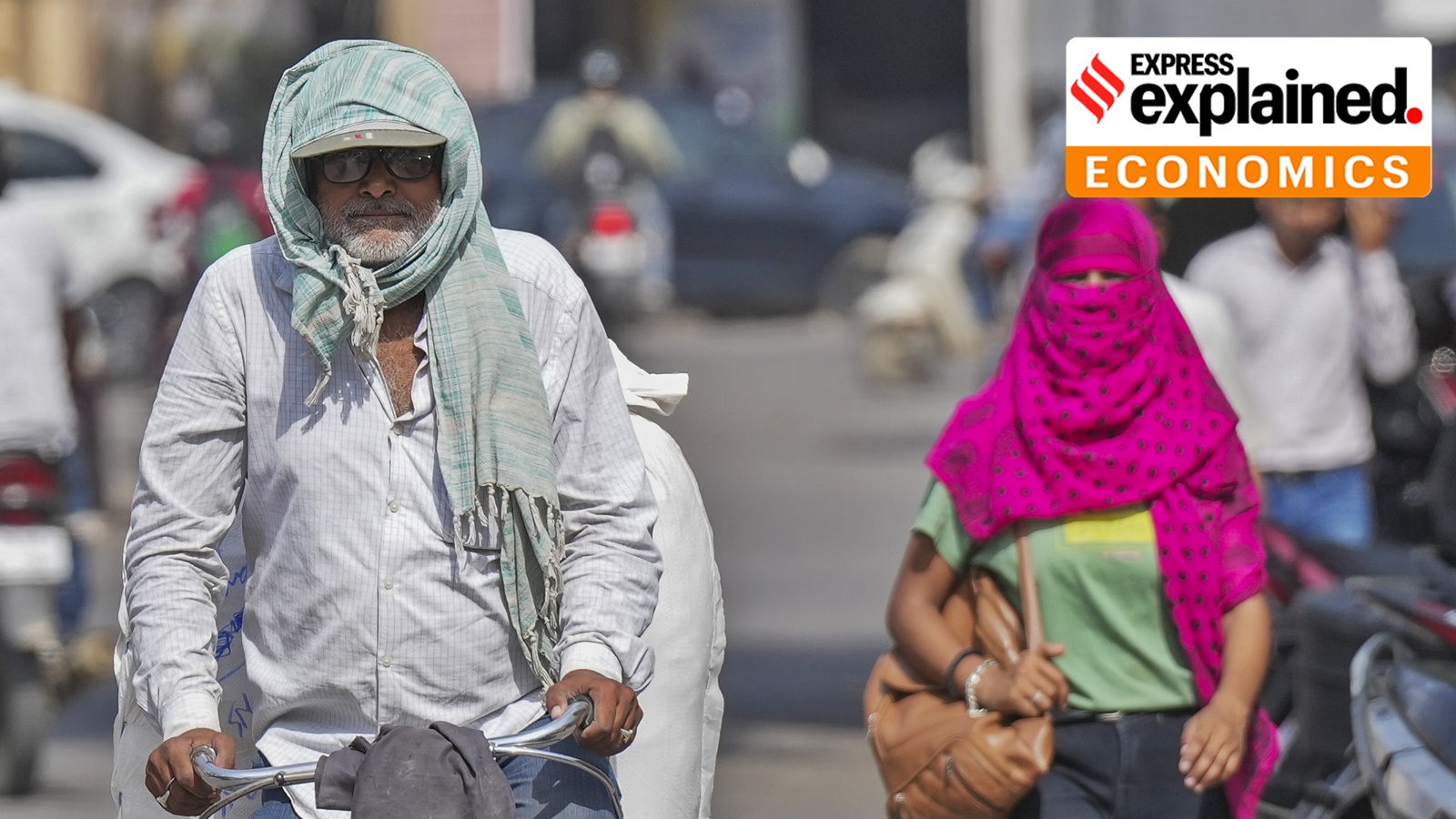Varanasi: A man covers his head with a scarf amid heatwave on a hot summer day, in Varanasi, Friday, May 31, 2024.