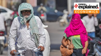 Varanasi: A man covers his head with a scarf amid heatwave on a hot summer day, in Varanasi, Friday, May 31, 2024.