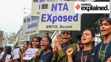 Students raise slogans during a protest over the alleged irregularities in NEET 2024 results, in Bhopal, Friday, June 14, 2024.