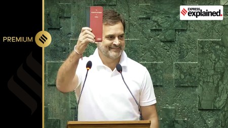 Congress MP Rahul Gandhi shows a copy of Constitution of India as he takes oath as a member of the House during the first session of the 18th Lok Sabha, in New Delhi, Tuesday, June 25, 2024.