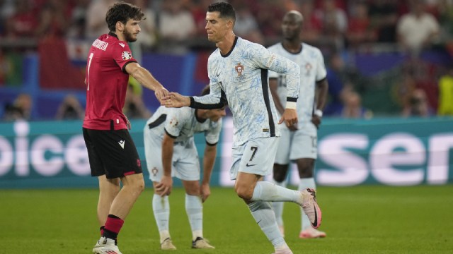 Portugal's Cristiano Ronaldo shakes hand with Georgia's Khvicha Kvaratskhelia as he after leaves the pitch during a Group F match between Georgia and Portugal at the Euro 2024 soccer tournament in Gelsenkirchen, Germany
