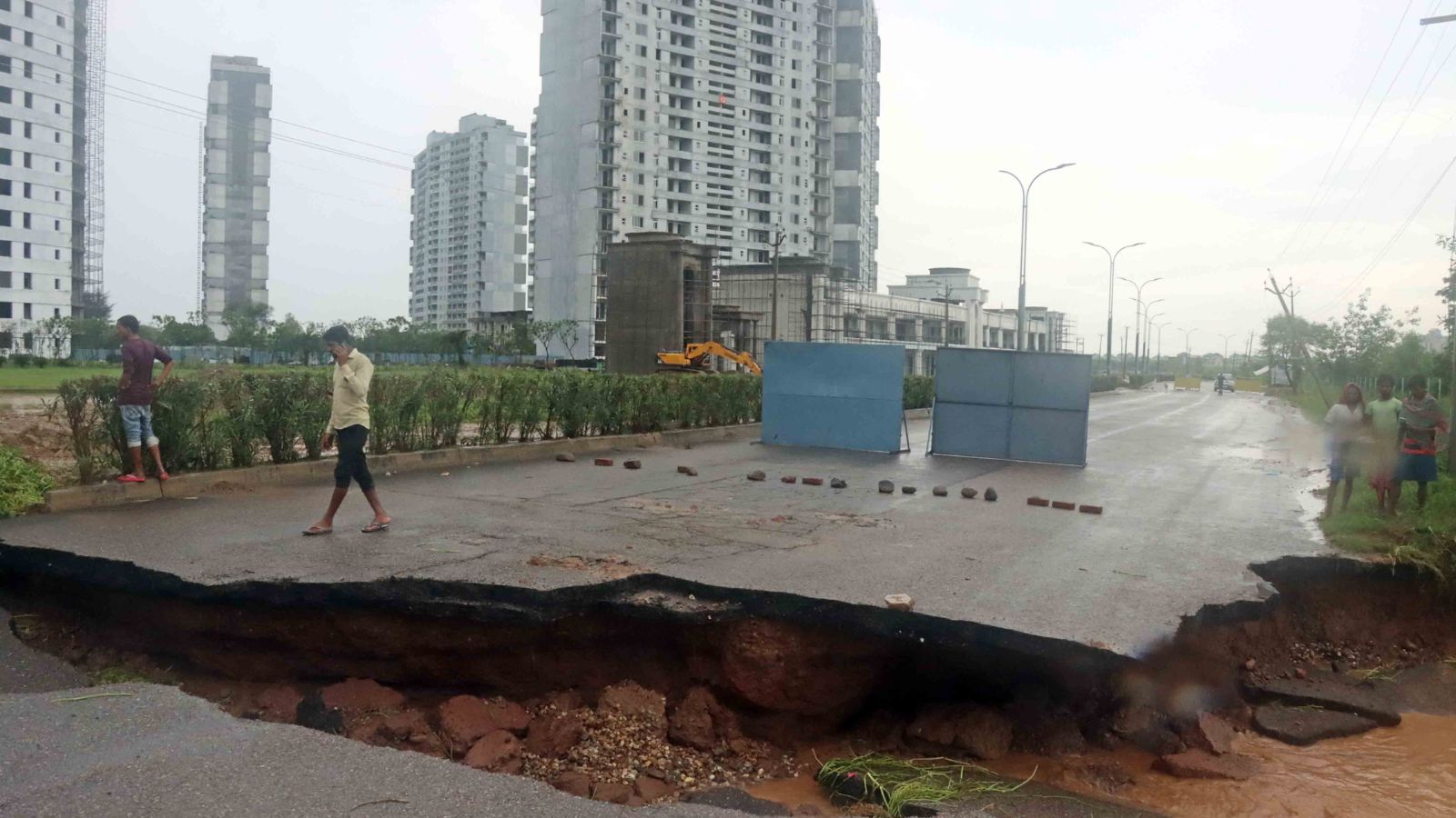 and, a portion of a road caved in, in New Chandigarh, Mullanppur, after heavy rainfall last year. 