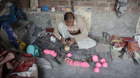A worker makes leather cricket balls at the Bootan Mandi area under the Jalandhar West (Reserved) Assembly segment. Over the past few decades, the hides business declined sharply by 80-90 per cent. (Express photo)