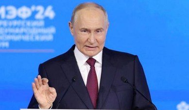 Russian President Vladimir Putin delivers a speech at a plenary session of the St. Petersburg International Economic Forum (SPIEF) in Saint Petersburg, Russia.
