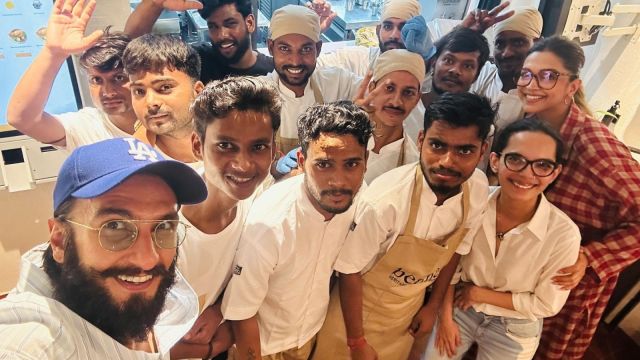 Ranveer Singh Deepika Padukone pose with the hotel staff