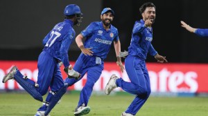 Afghanistan's captain Rashid Khan is celebrates with teammates after dismissing Bangladesh's Rishad Hossain during the men's T20 World Cup cricket match between Afghanistan and Bangladesh at Arnos Vale Ground, Kingstown, Saint Vincent and the Grenadines