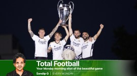 Real Madrid's Toni Kroos, Real Madrid's Luka Modric and Dani Carbajal with the trophy after placing the traditional scarf at the Fuente de las Cibeles after winning the Champions League